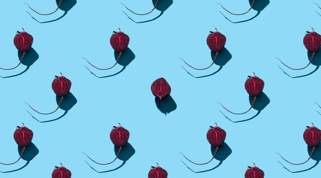 Fresh beets on a blue background
