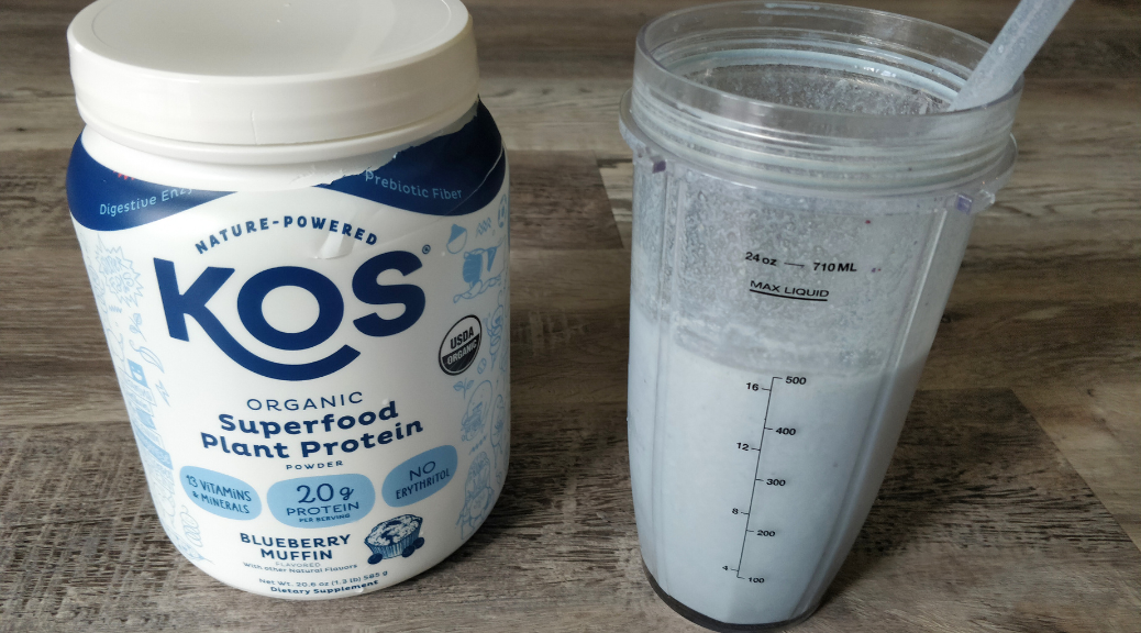 KOS Plant Protein Powder and protein shake in blender cup